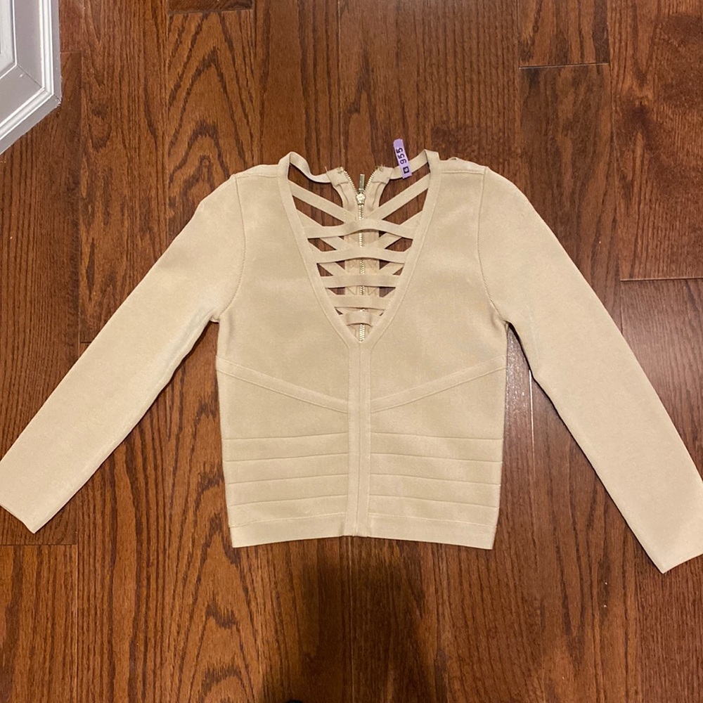 Bebe top; never worn; excellent conditions cream color; size XS